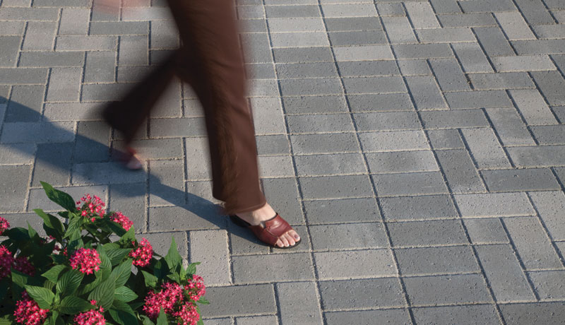 Woman walking on pavers