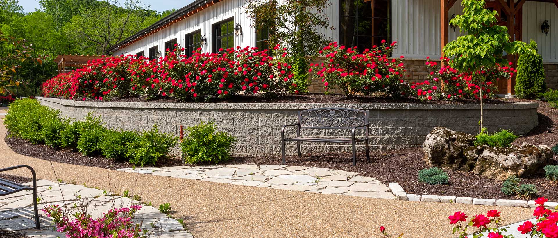 Retaining wall by a flower bed